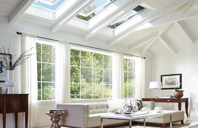 A drone shot of a newly installed roof on a modern home.