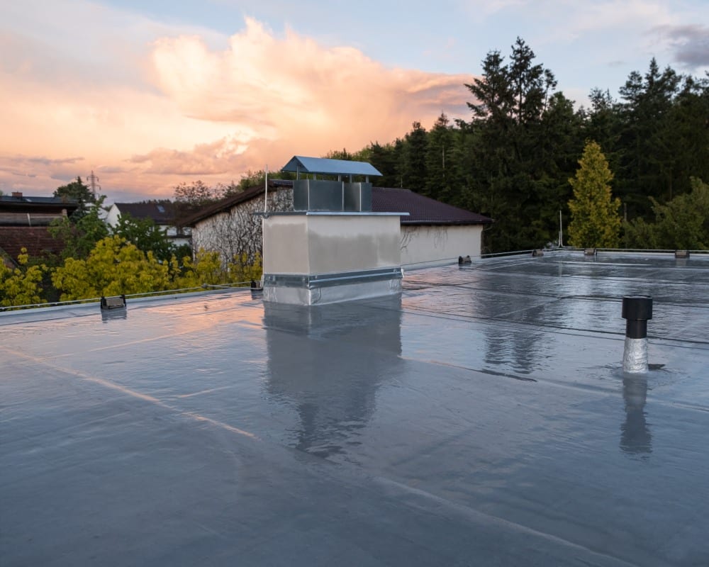 Professional roof coating application in New Hampshire by Compass Exteriors