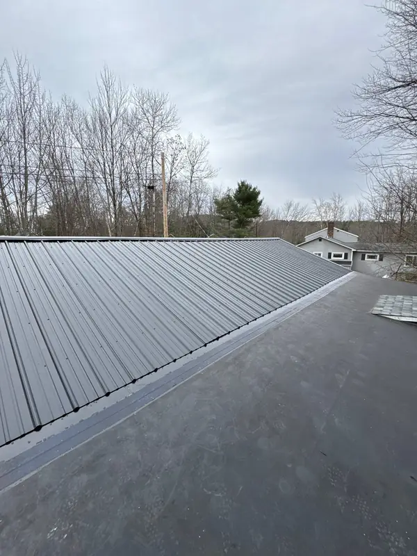 Lake Winnipesaukee Home Gets a Screw-Down Metal Roof — Gilford, NH — completed by Compass Exteriors in Gilford