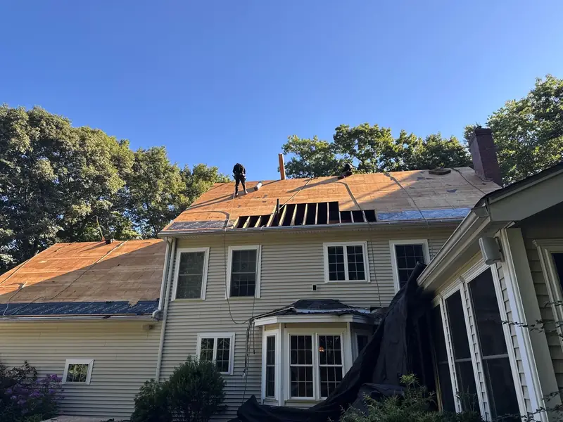Multi-Facet Asphalt Roof Replacement With Velux Skylights on Lyford Lane in Brentwood, NH — completed by Compass Exteriors in Brentwood