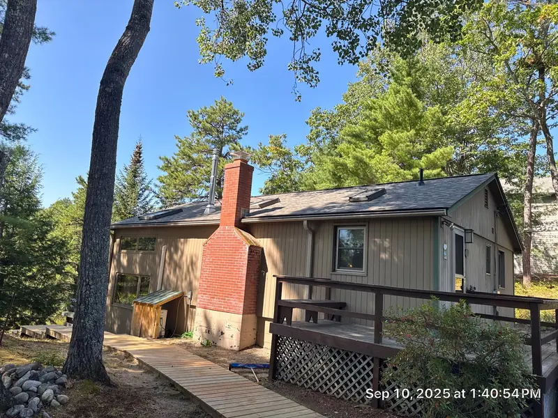 Matching Driftwood Shingles on House and Shed — Center Ossipee, NH — completed by Compass Exteriors in Center Ossipee