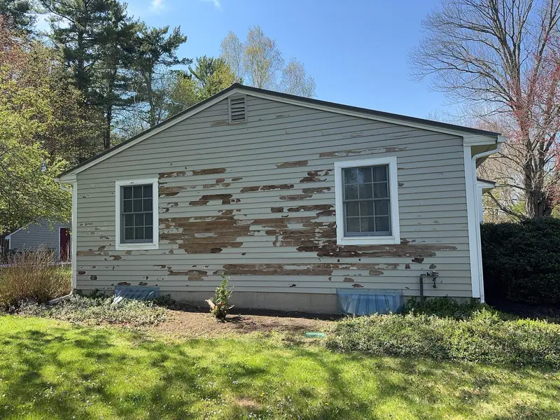 Vinyl Siding Replacement and Extensive Rot Repair on a Ranch Home in North Hampton, NH — completed by Compass Exteriors in North Hampton