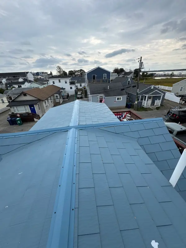 Corroded Fastener & Seam Repair on a Metal Roof — Hampton, NH — completed by Compass Exteriors in Hampton