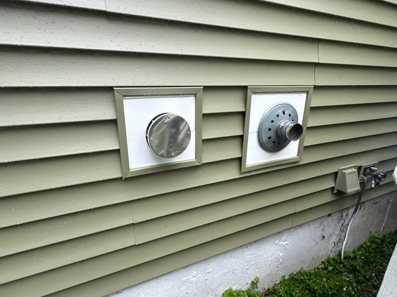 New Front Door and Almond Trim Complete a Siding Job — Newmarket, NH — completed by Compass Exteriors in Newmarket